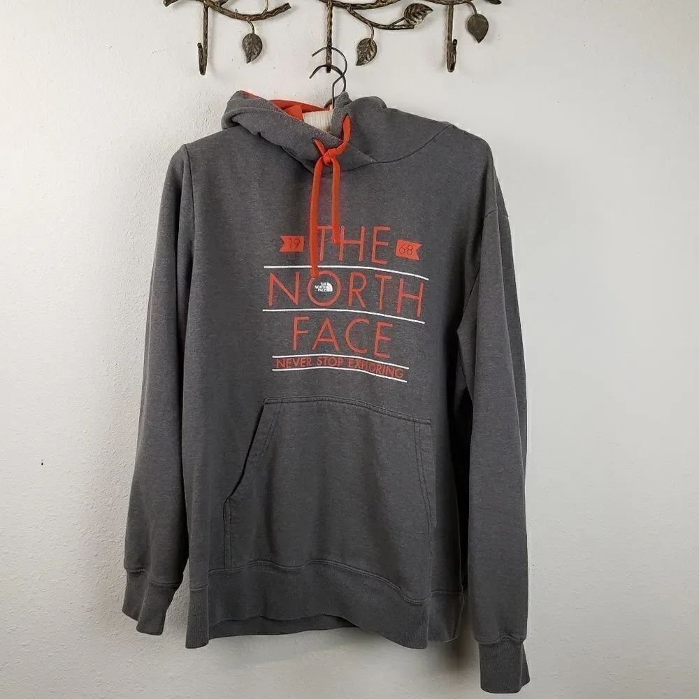 The North Face gray hooded sweatshirt orange logo
